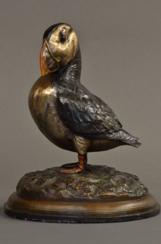 A bronze sculpture of an Atlantic Puffin by Jim Green